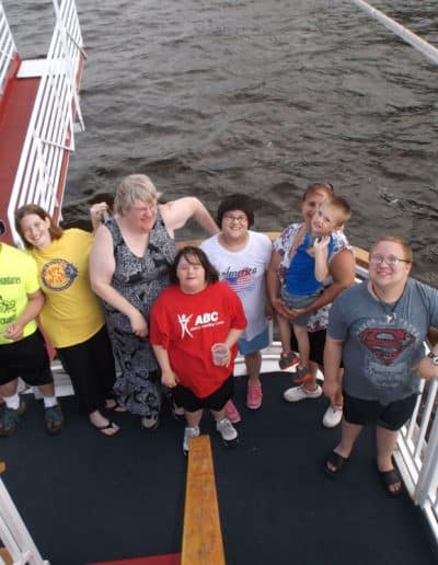 A group poses for a photo on the La Crosse Queen
