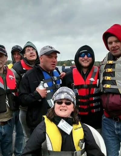 A day on the river - a group gathers on a pontoon boat for a photo